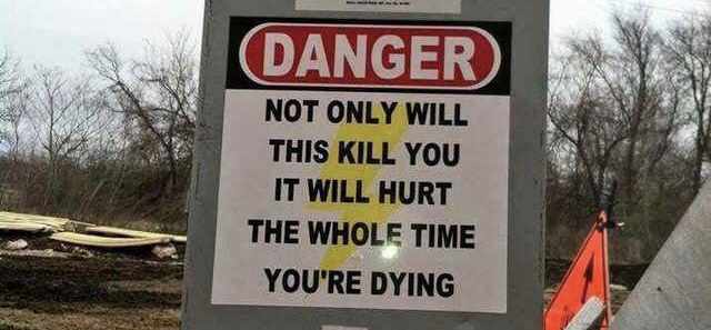 sign saying 'not only will this kill you it will hurt the whole time you're dying